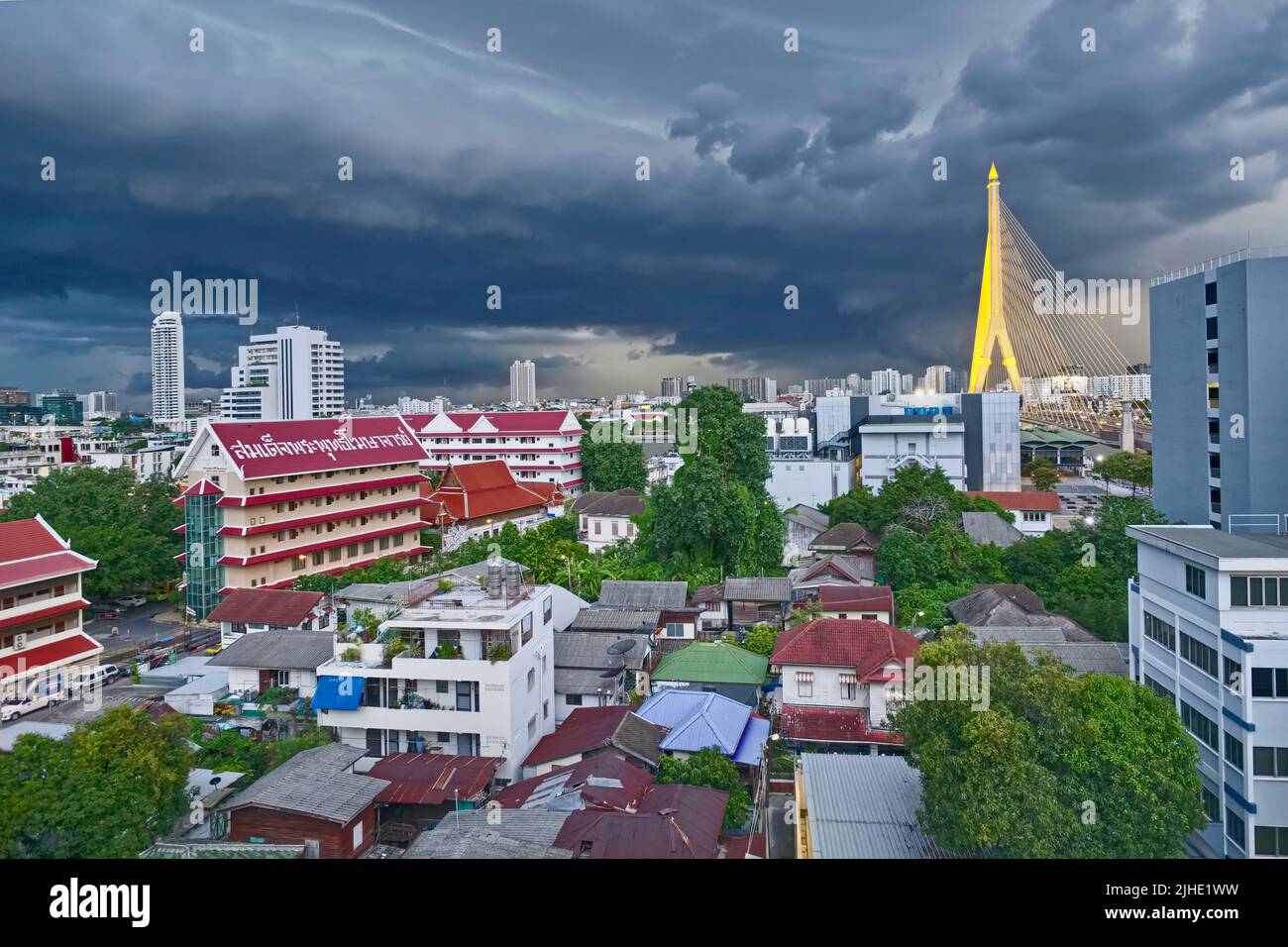 Monsoon clouds over Rama XIII. Bridge (r) and (temple) Wat Sam Phraya (l) in the Phra Nakhon area of Bangkok, Thailand, Bangkok's old city center Stock Photo
