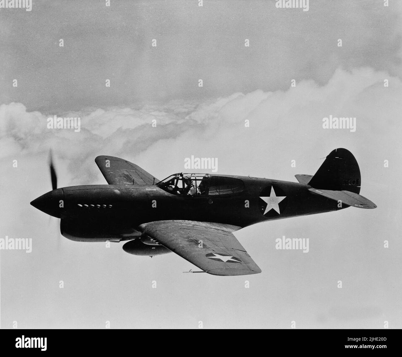 Vintage photo circa 1942 of an American Curtis P-40 single-engine fighter plane in flight. It served with the RAF (Royal Air Force) and with the AVG (American Volunteer Group or Flying Tigers) in China and with the US army air force in the Pacific theatre Stock Photo