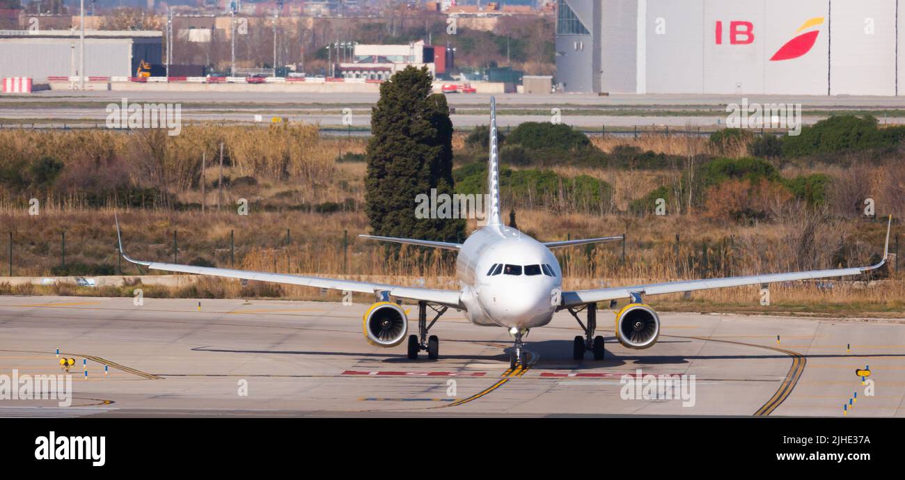 Airline Vueling plane takes off from the runway at Barcelona El Prat