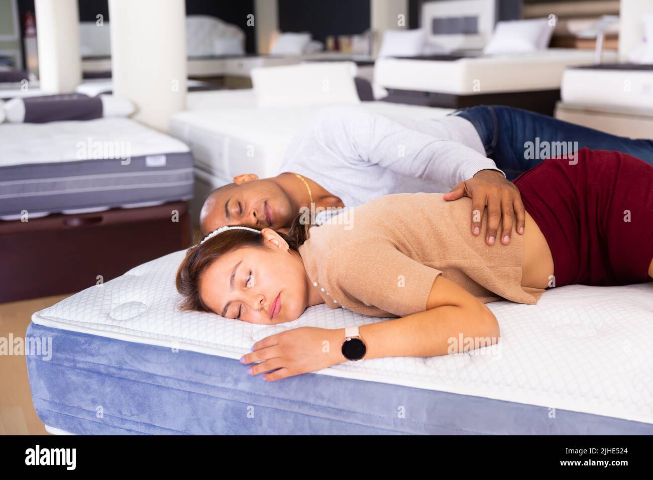 Choosing man mattress bed hires stock photography and images Alamy