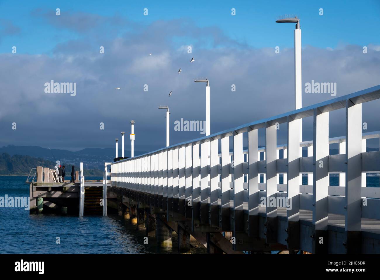 White fence on Days Bay Wharf, Eastbourne, Wellington, North Island, New Zealand Stock Photo