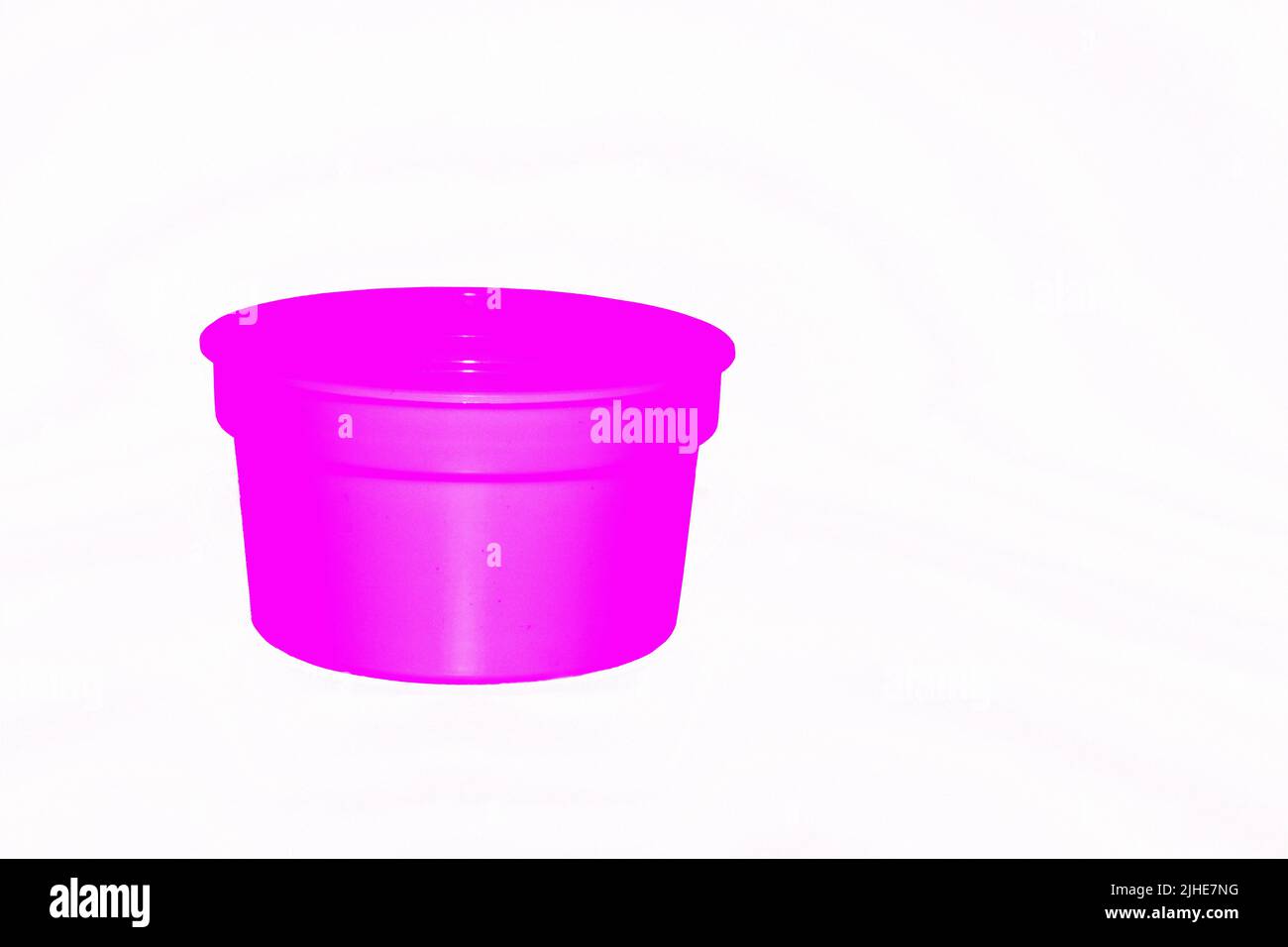 https://c8.alamy.com/comp/2JHE7NG/delicate-pink-purple-plastic-jar-capacity-of-isolated-on-white-2JHE7NG.jpg