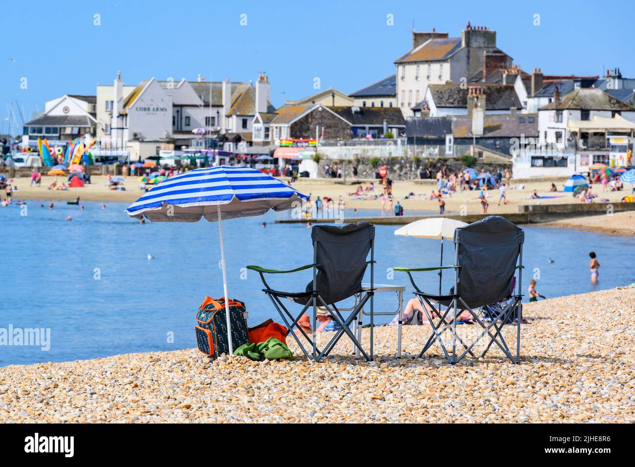 Lyme Regis, Dorset, UK. 18th July, 2022. UK Weather Sun seekers were