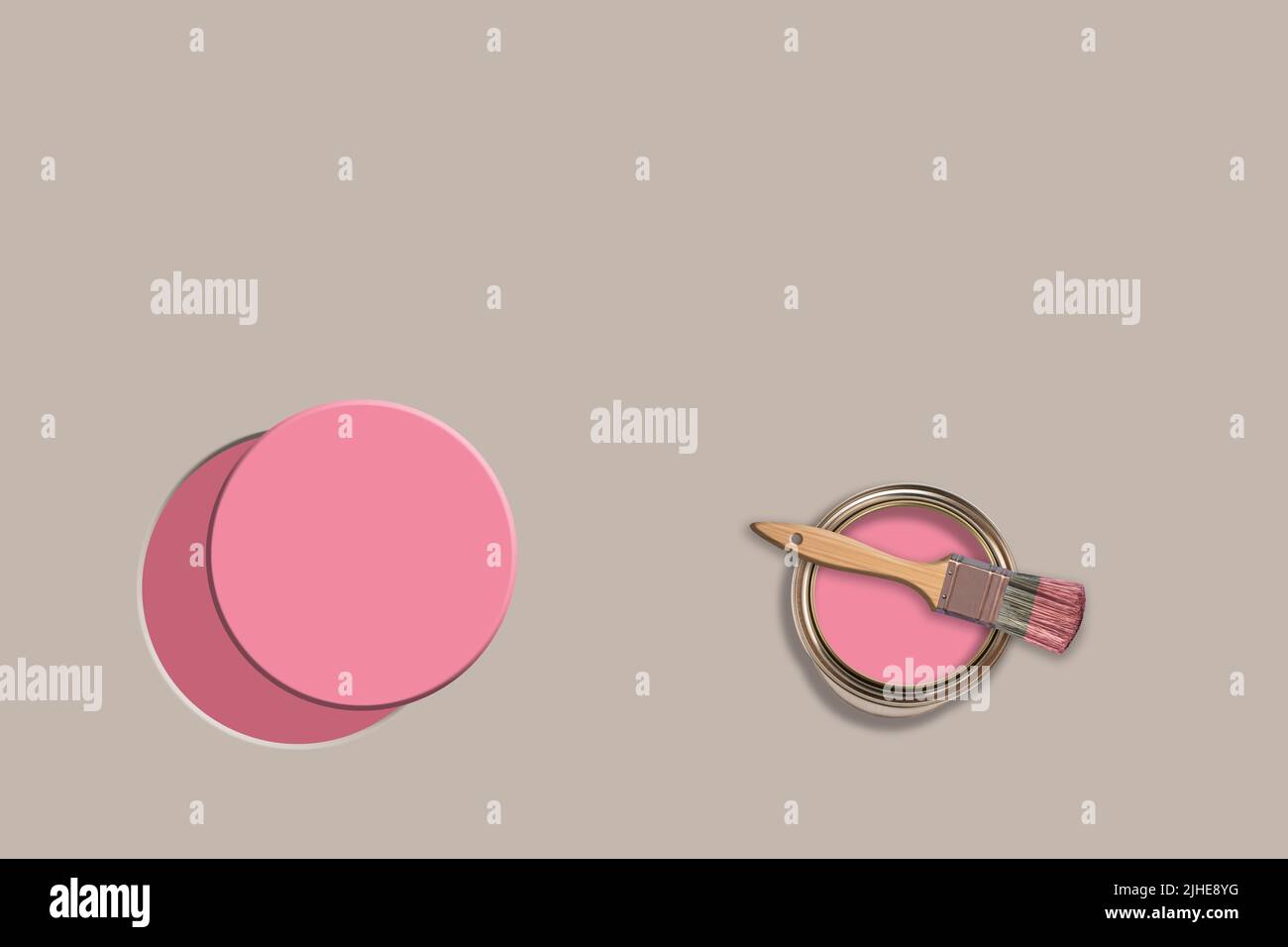 creative concept image of decorating remodeling painting paint paint pot can tin brush on a colourful grey background painted pink circle Stock Photo
