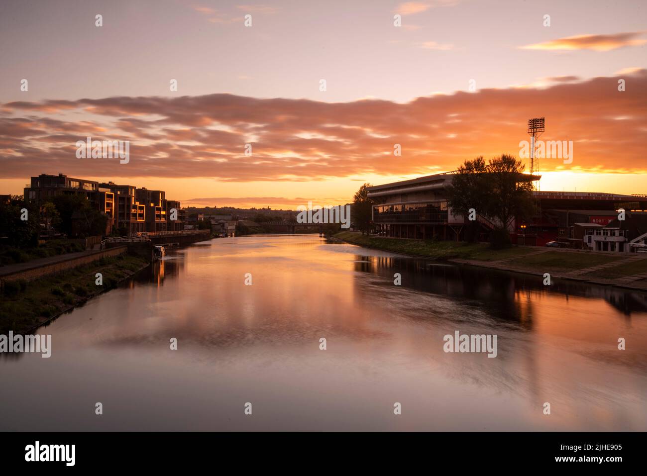 Sunrise on the River Trent at the City Ground and Trent Bridge Quays in Nottingham Nottinghamshire England UK Stock Photo