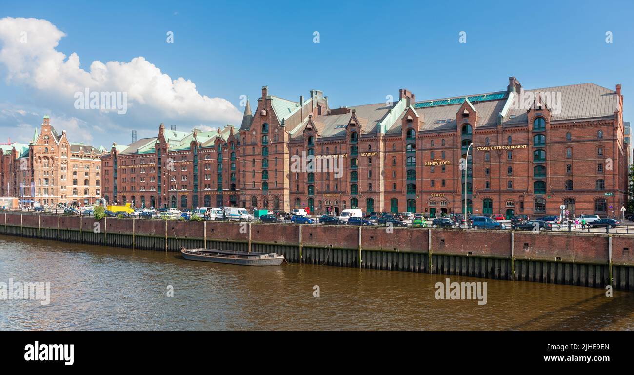 Hamburg, Germany - July 12, 2011 : Kehrwieder ( street ) waterfront with arts and cultural buildings. Section of canal leading into Elbe River. Stock Photo