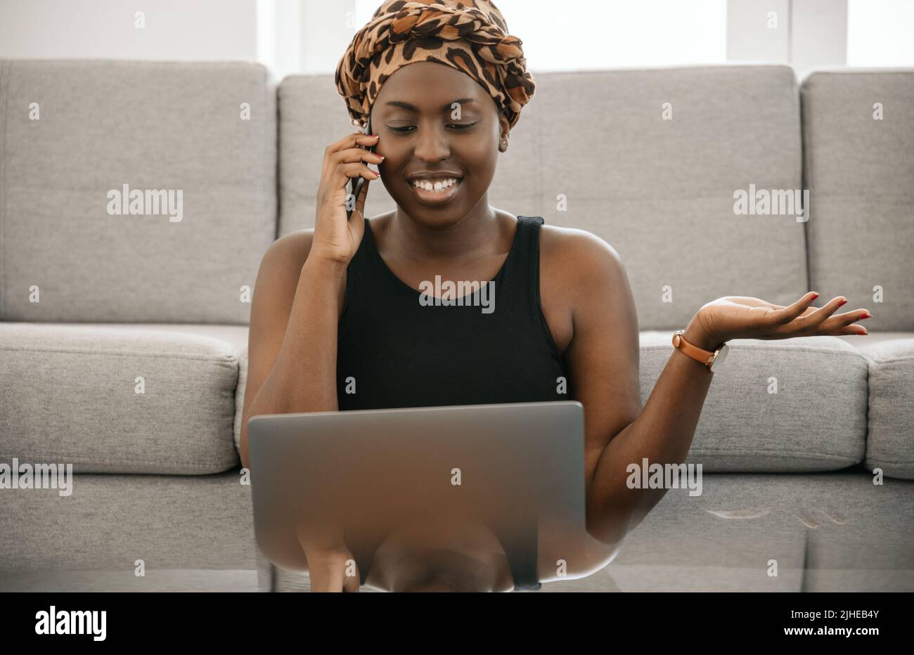 African woman phone laptop hi-res stock photography and images - Alamy