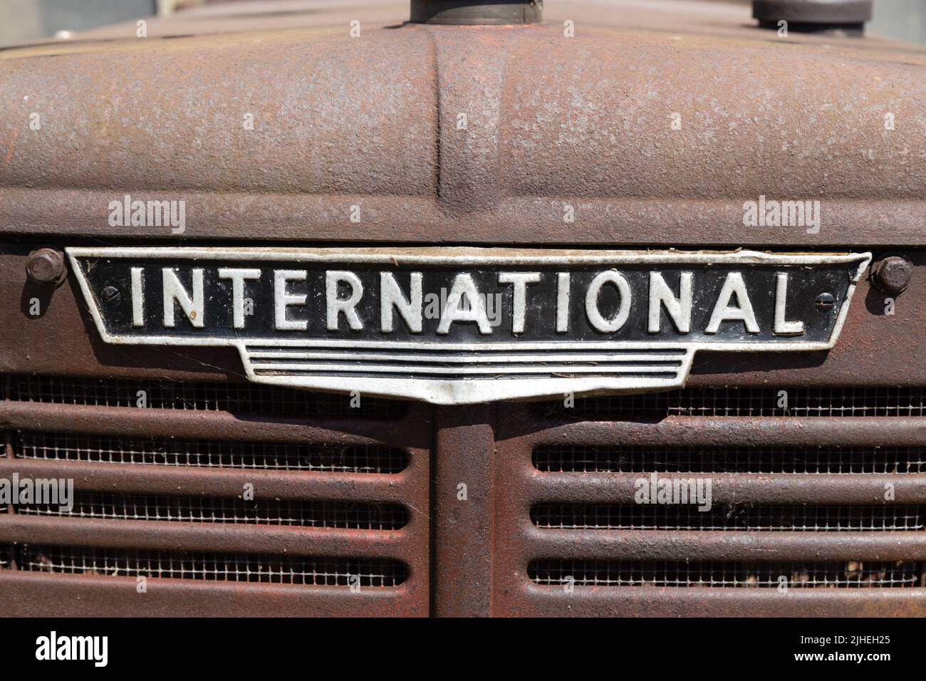 International badge logo on rusty caterpillar track truck Stock Photo