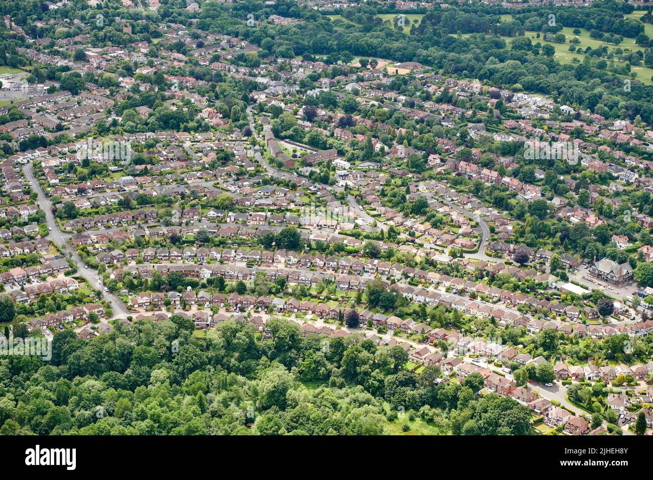 An aerial view of large middle class houses, at Handforth, South