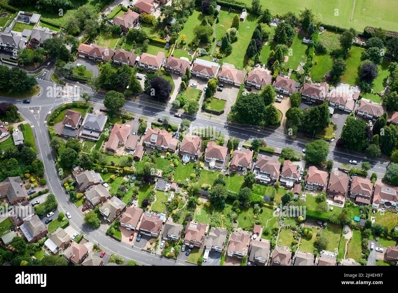 An aerial view of large middle class houses, at Handforth, South