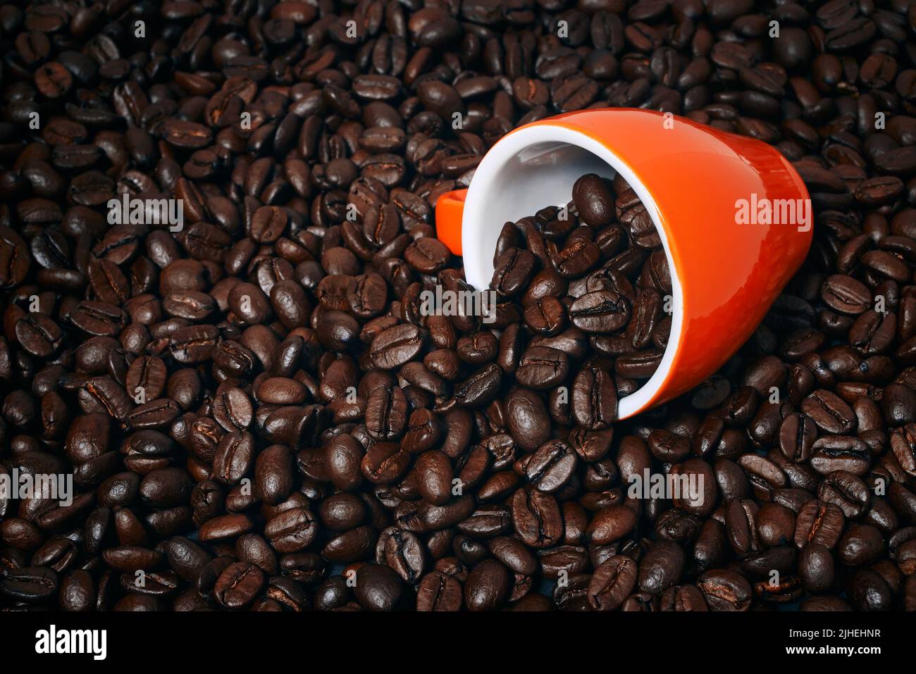 coffee cup laying on coffee beans mockup Stock Photo Alamy