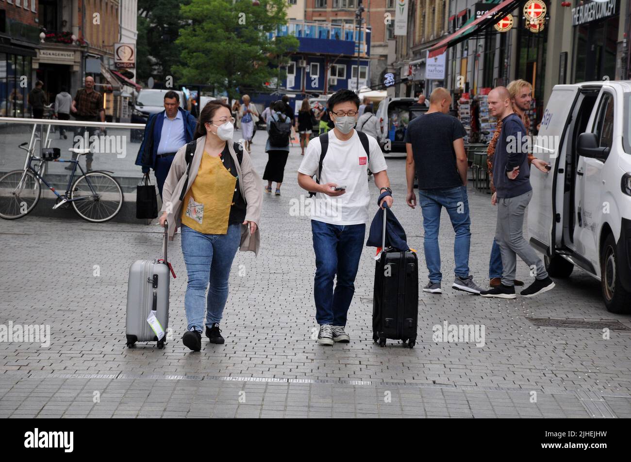 Copenhagen /Denmark/18 July 2022/Asian travellers with face mask in