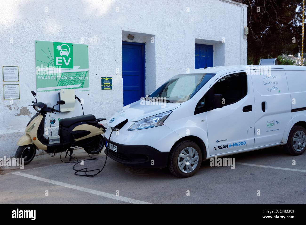 Solar powered electric car charging station, Livadia, part of the Just Go Zero Tilos initiative, Tilos, Dodecanese islands, Southern Aegean, Greece. Stock Photo