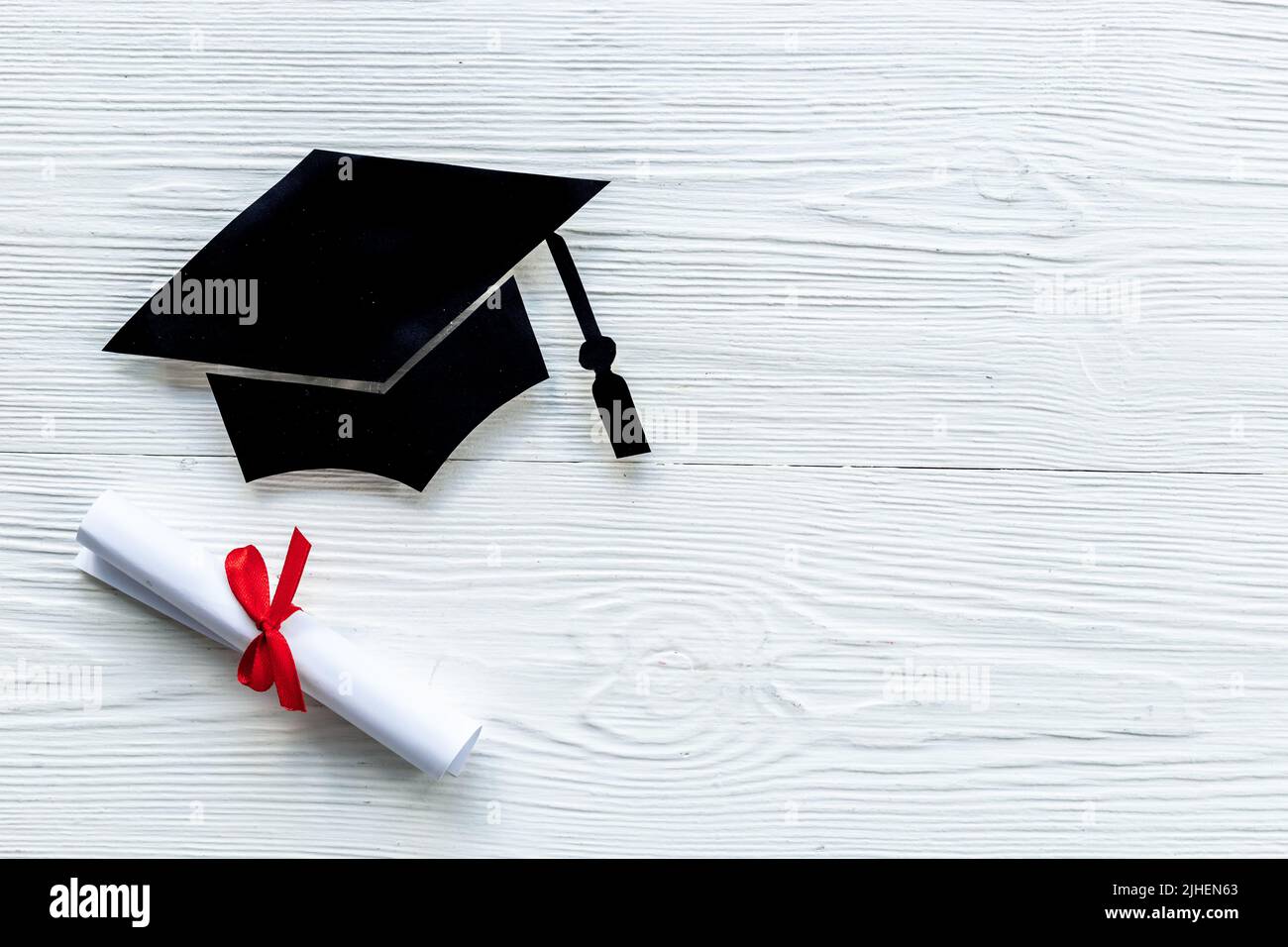 Black mortarboard graduation cap paper cut with diploma. Education concept  Stock Photo - Alamy