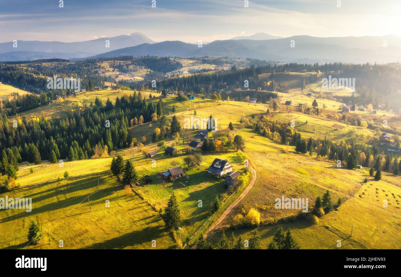 Aerial view of beautiful village in mountains at sunset Stock Photo