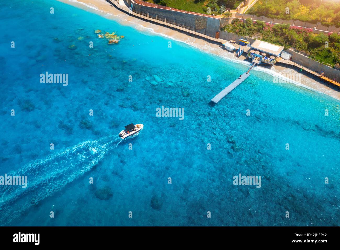 Aerial view of speed boat on blue sea at sunset in summer Stock Photo