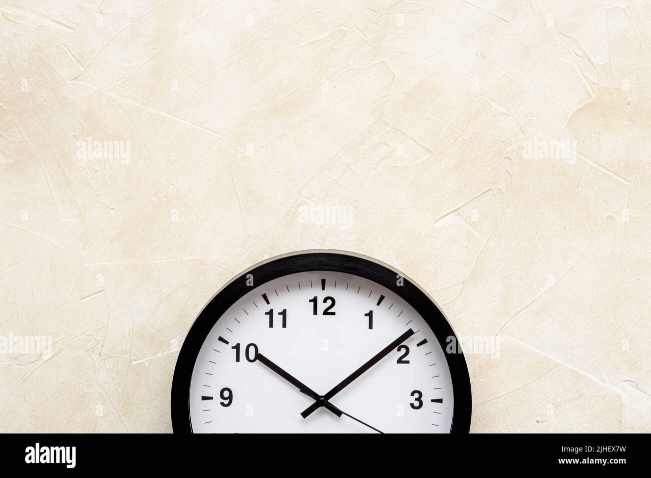 Round wall black and white clock. Time to work or rest concept Stock