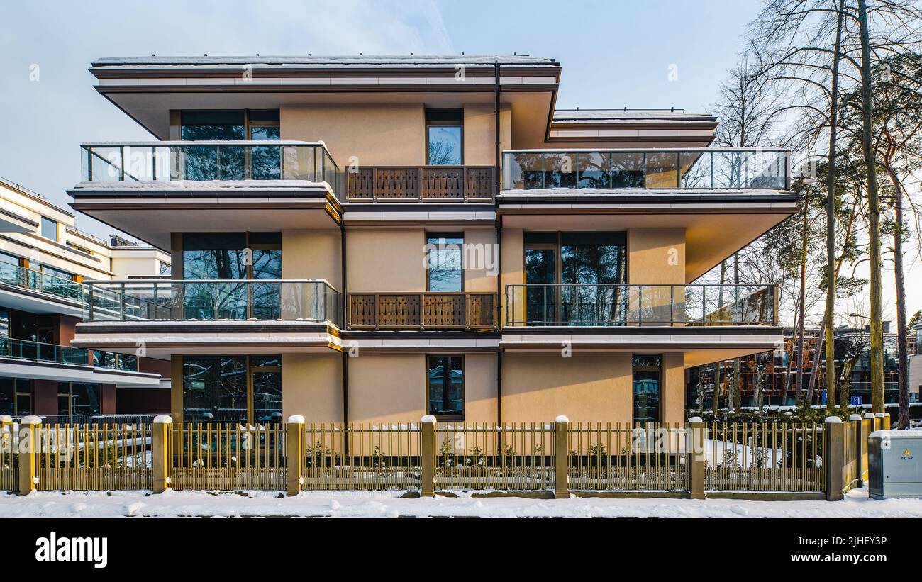 Modern facade of new residential building at winter. Private house ...