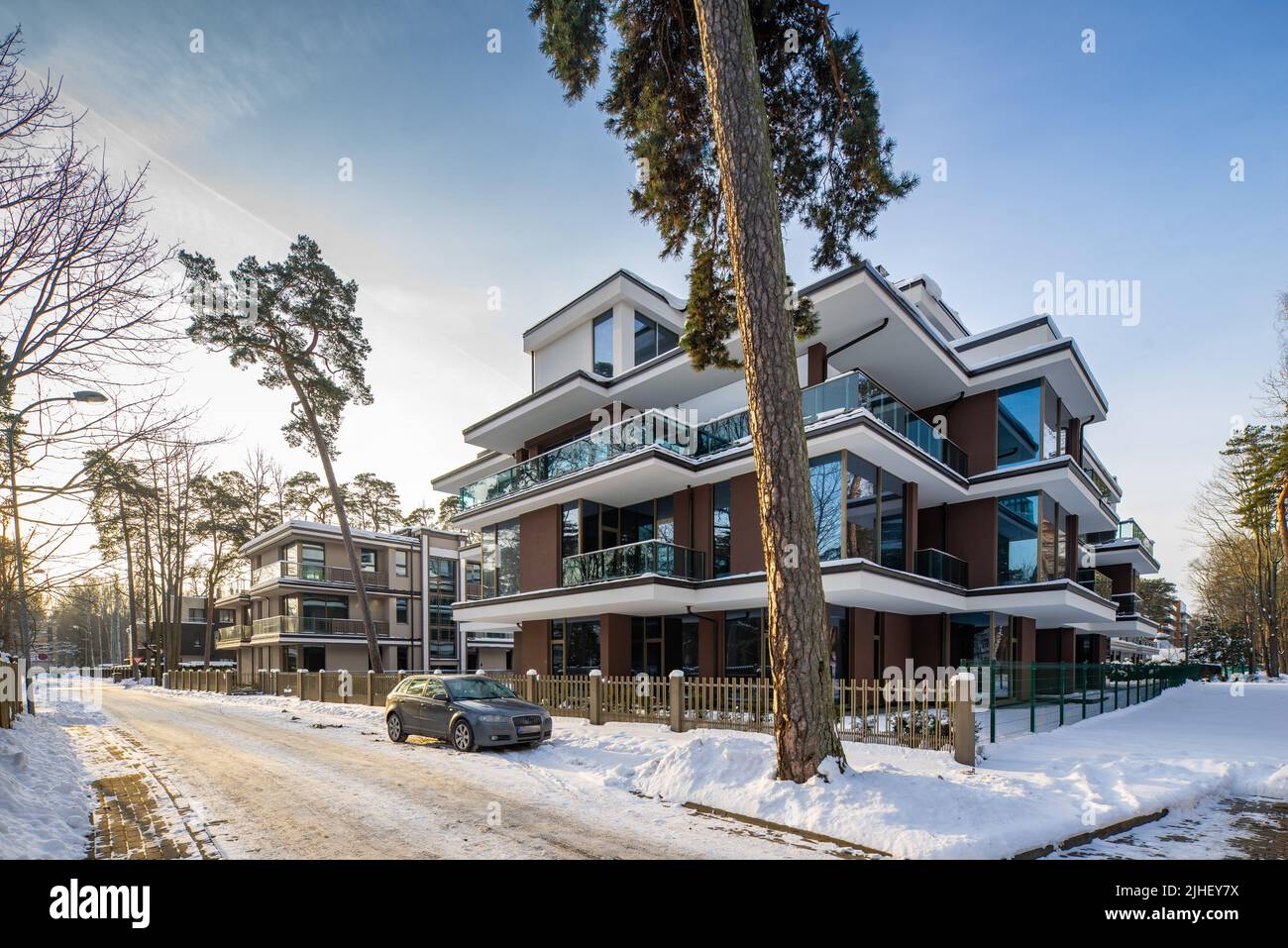 Modern exterior of new luxury residential building at winter. Huge pine ... - Luxury Residential Building Exterior Architecture