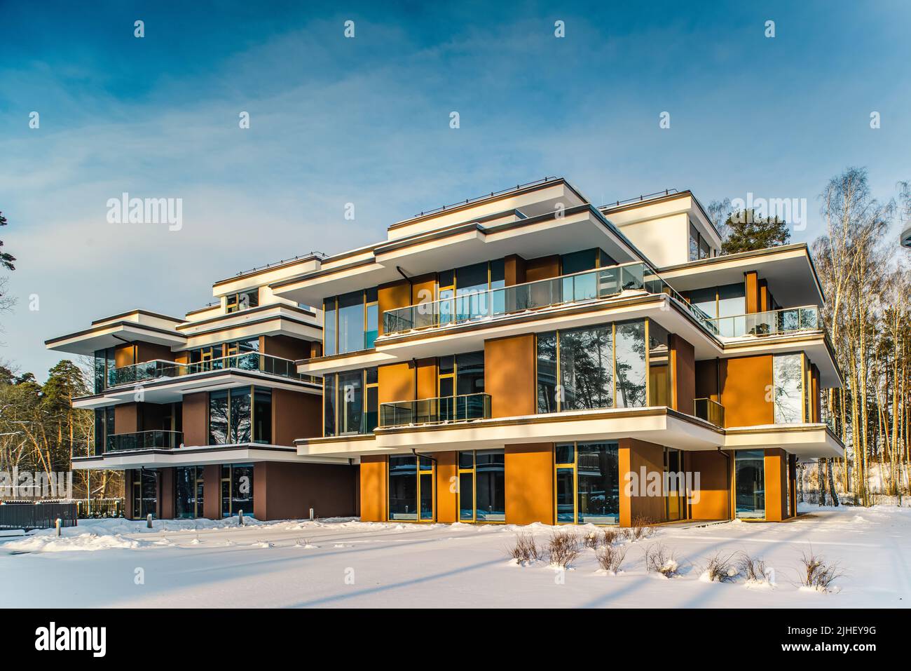 View of Modern exterior of new luxury residential building at winter. Private ...