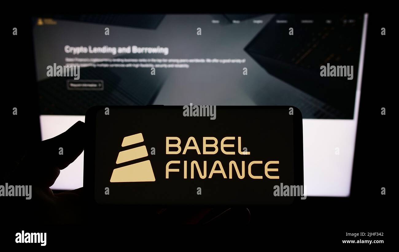 Person holding smartphone with logo of crypto company Babel Finance on ...