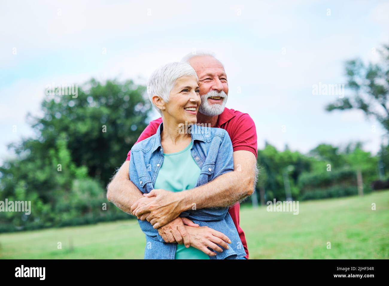 senior couple happy elderly love together retirement lifestyle smiling man woman mature fun Stock Photo
