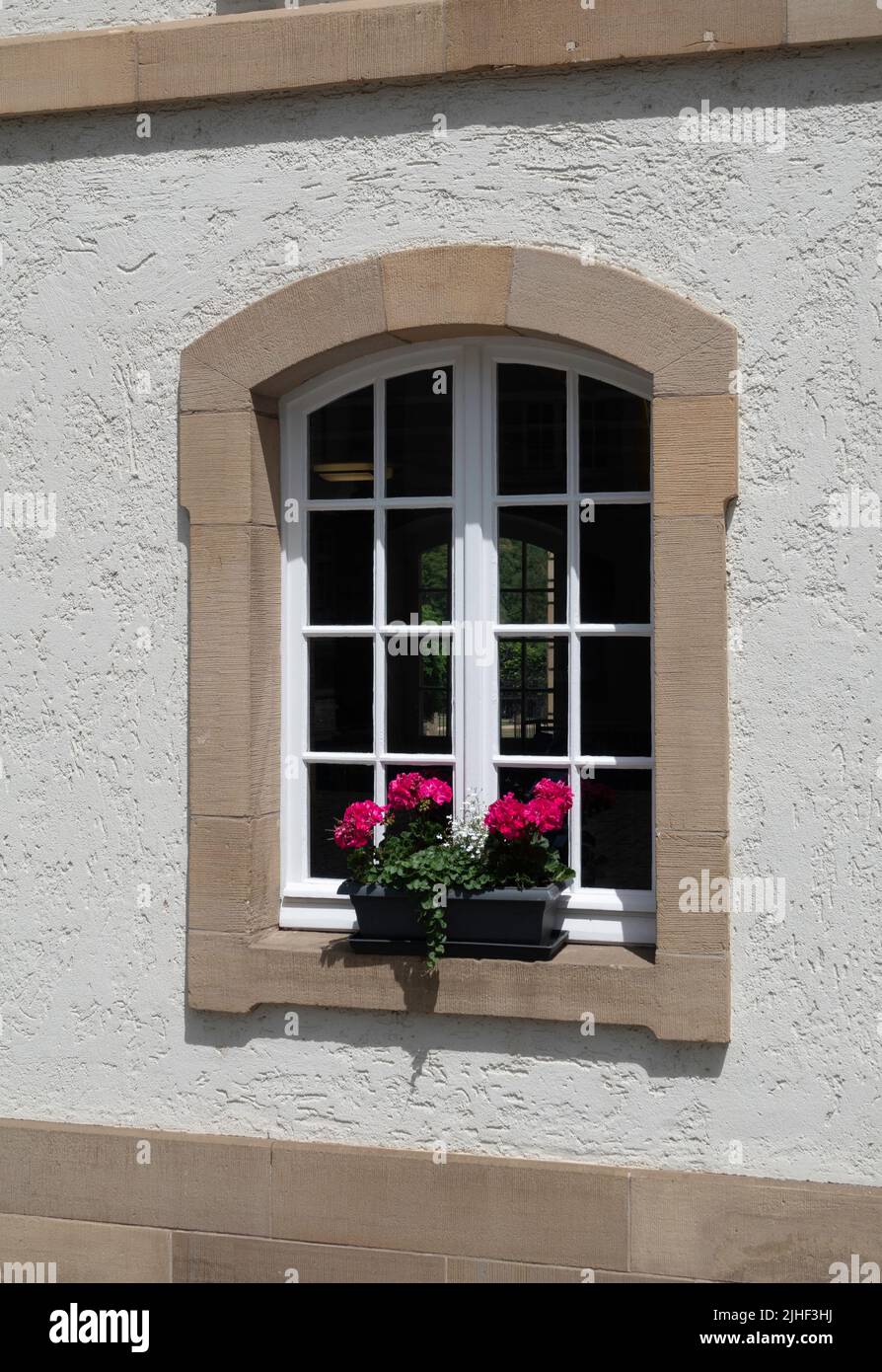 a white house in luxembourg with beautifull flowers Stock Photo