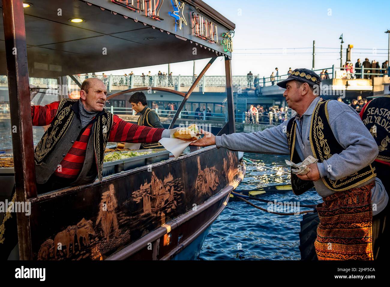 Grilled fish sandwiches prepared at a boat and sold directly at the