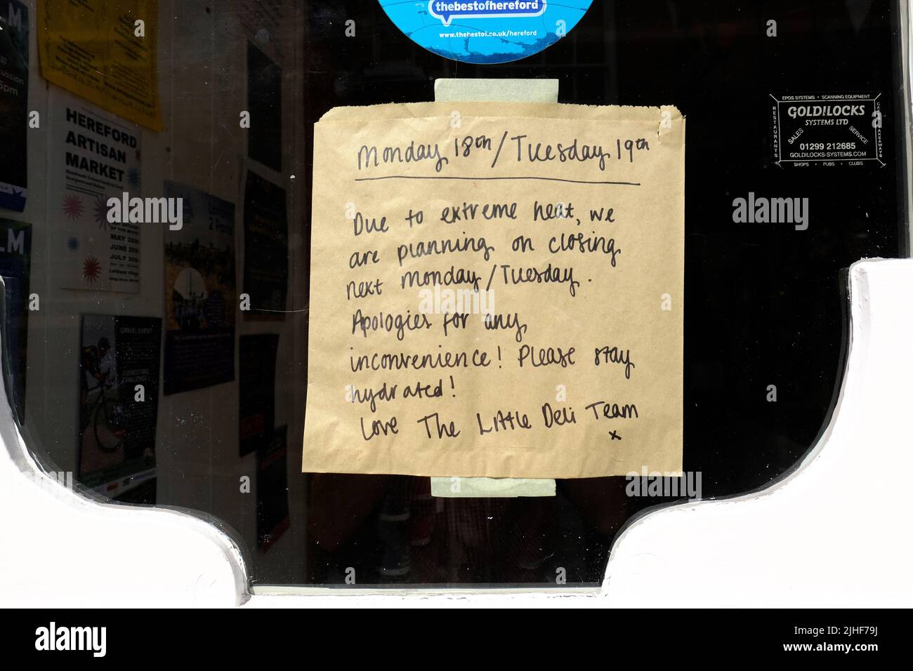 Hereford, Herefordshire, UK - Monday 18th July 2022 - A sign on a delicatessen shop says the business will be closed due to the extreme heat on Monday 18th and Tuesday 19th as UK temperatures approach 40c. Photo Steven May / Alamy Live News Stock Photo