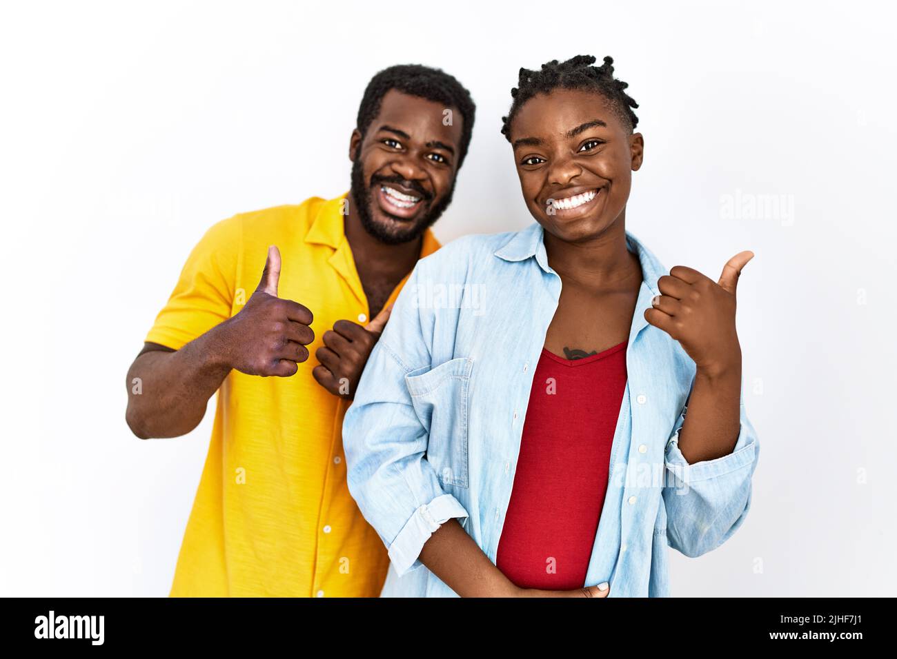 Young african american couple wearing casual clothes success sign doing ...