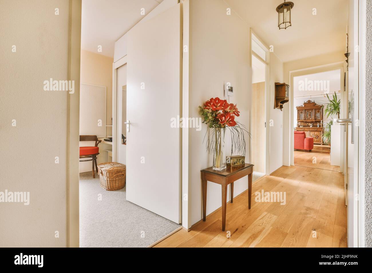 Narrow corridor with white walls and doors leading to spacious rooms ... - Penthouse Apartment Floor Plan Design For Narrow Corridors