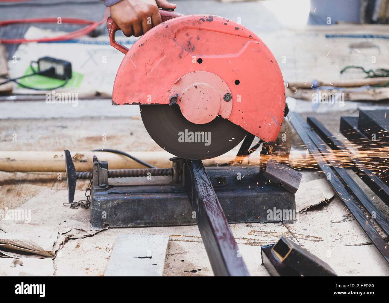 The technician uses a hacksaw to cut steel Stock Photo Alamy