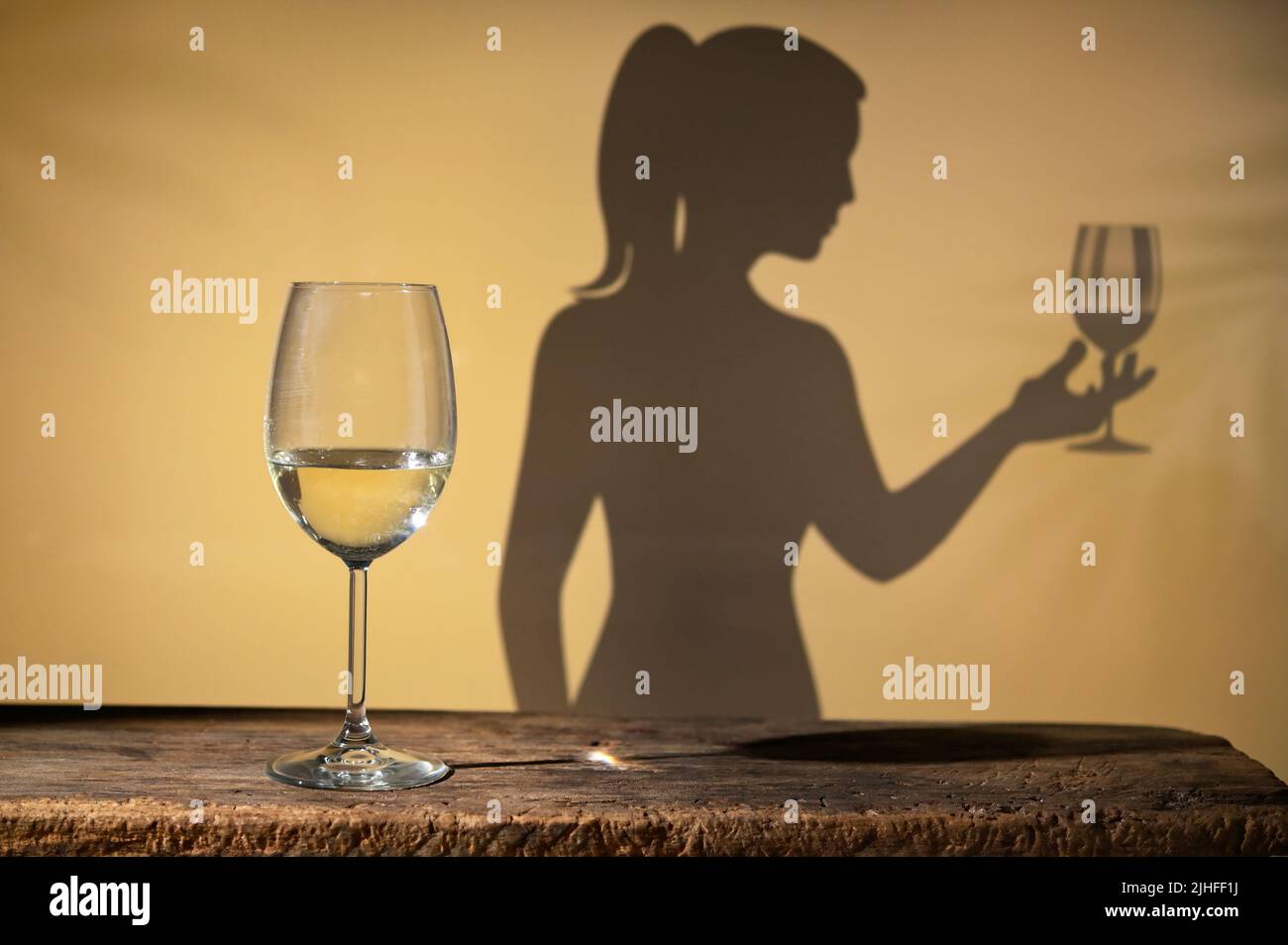 Abstract Woman shadow with Wine Glass and  White Wine Glass Stock Photo