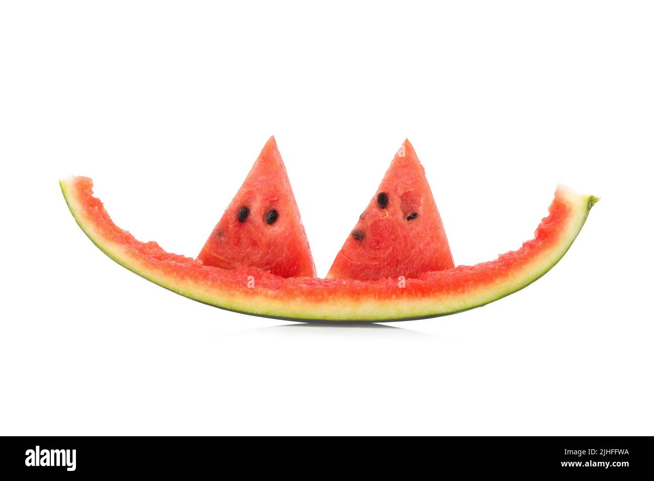 Watermelon slice eaten, isolated on white background. Stock Photo