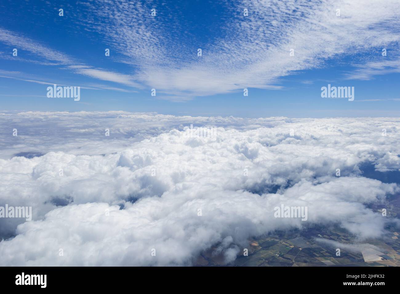 Cloud and blue sky from the airplane window Stock Photo