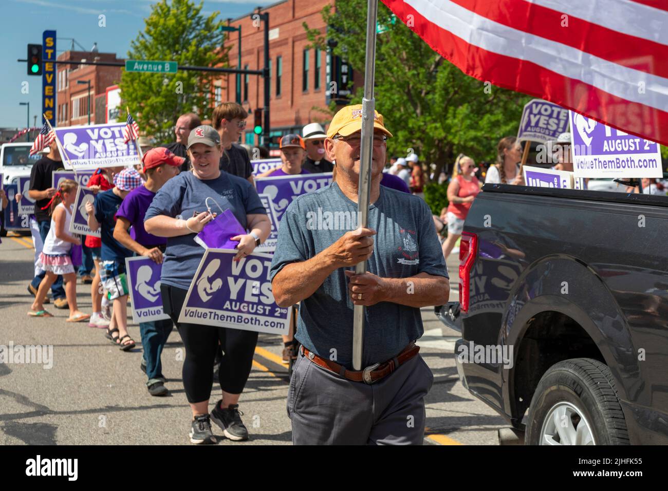 Hutchinson, Kansas - Anti-abortion activists march in the annual July 4 'Patriots Parade,' promoting the 'Value Them Both' constitutional amendment to Stock Photo