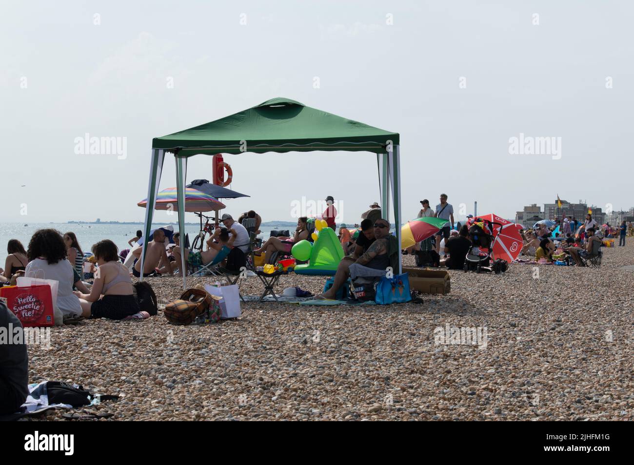 Gazebo tent to beat heat in Brighton beach Heatwave 2022 Stock Photo