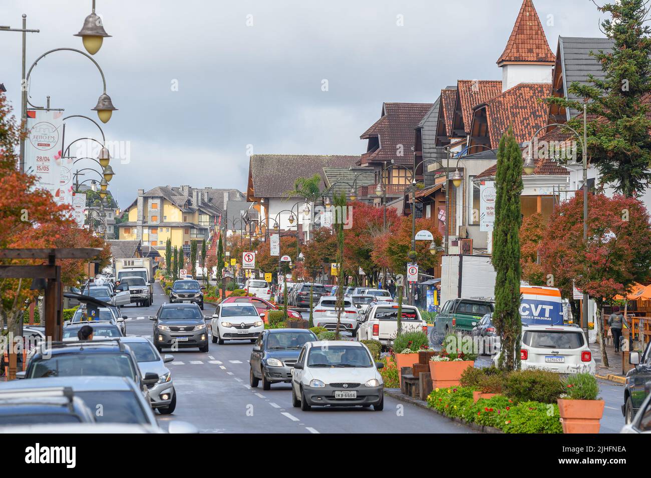 Gramado, RS, Brazil - May 19, 2022: view of the traffic and architecture around Borges de Medeiros avenue on a cloudy day of autumn. Downtown of Grama Stock Photo