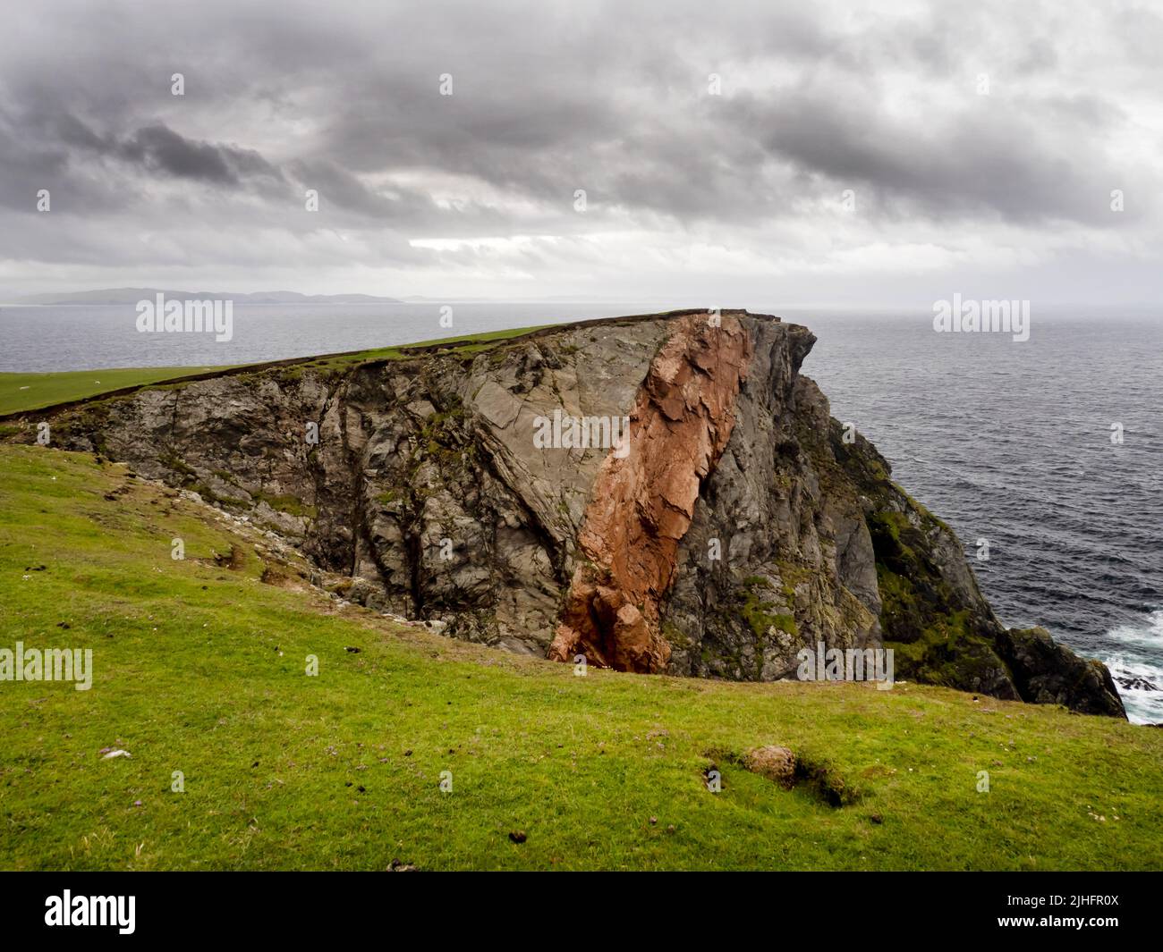 An orange ban in metamorphic rock on the Ness of Hillswick, Mainland ...