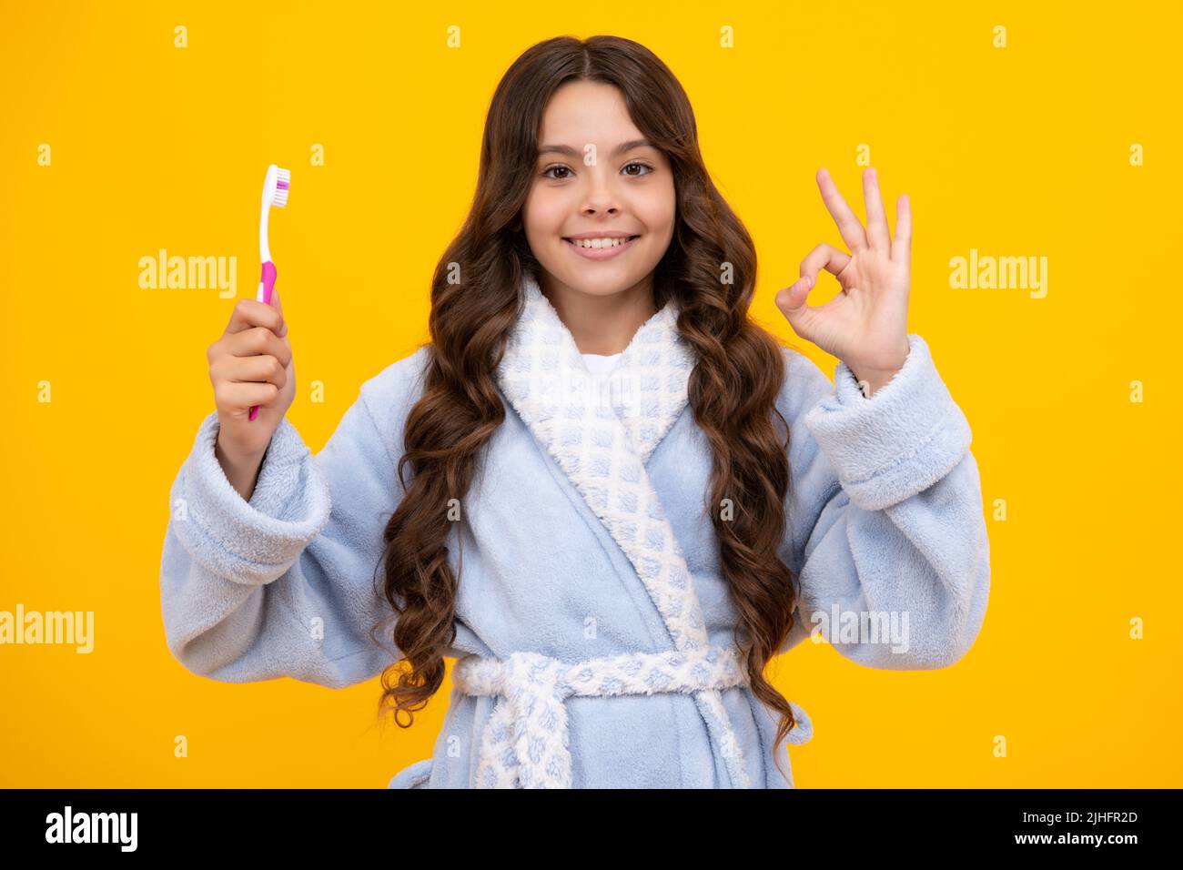 Night brushing teeth. Girl cleaning teeth. Kid brushing teeth with