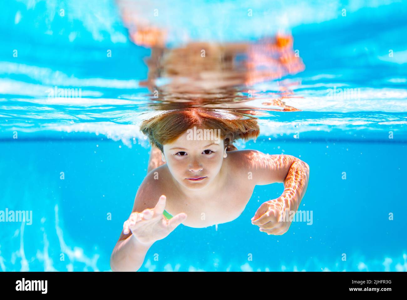 Child swim and dive underwater in the swimming pool Stock Photo Alamy