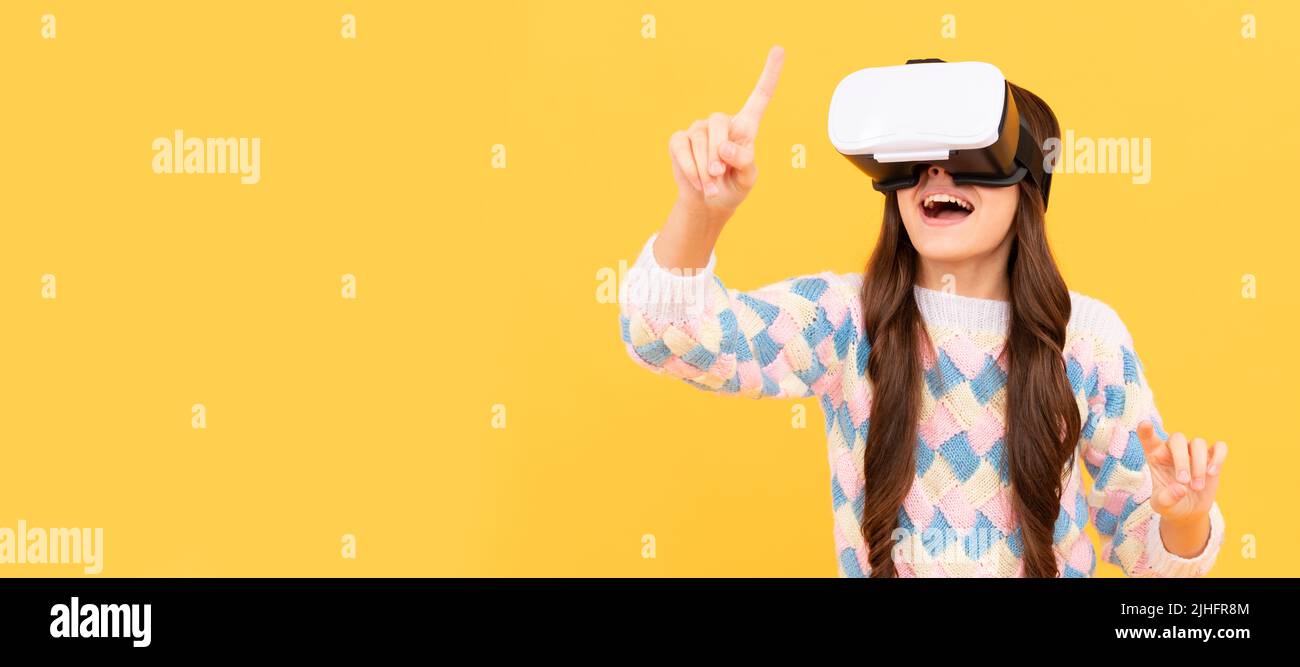 using VR headset. kid play video game. Digital future and innovation. child in virtual goggles. Banner of child girl with virtual reality vr headset Stock Photo
