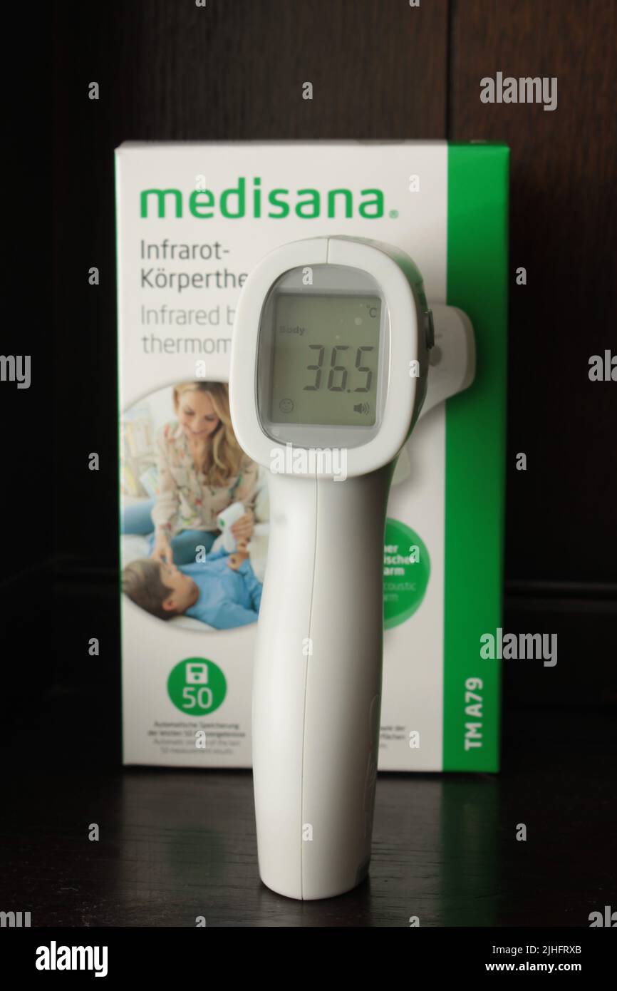 36.5 °C displayed on a infrared body thermometer on a dark background. 18-07-2022, Lancashire UK Stock Photo