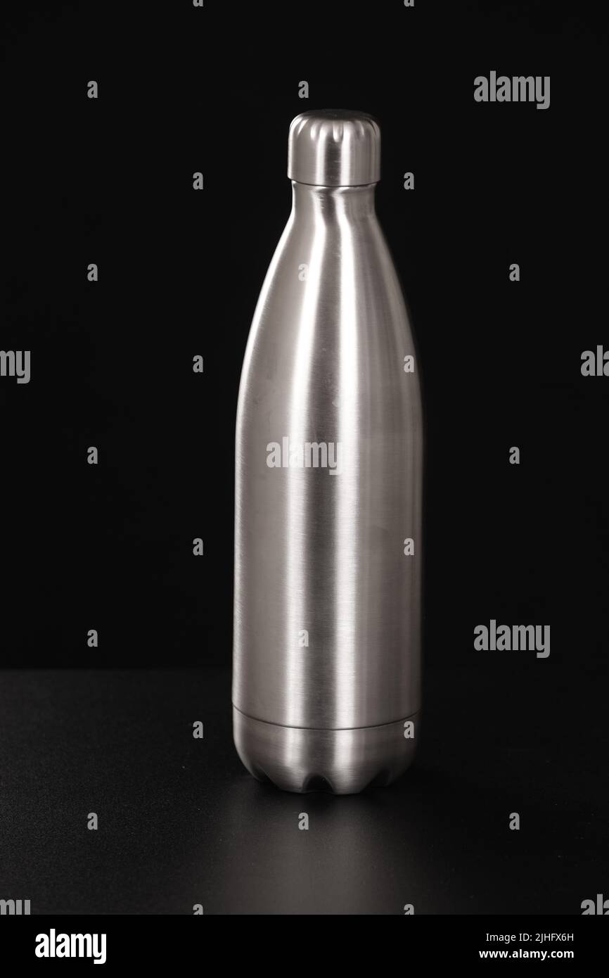 Thermo Water Bottle Isolated on White. Stainless Steel Thermos with Double Walls Front View. Silver Insulated Drinking Cups. Modern Travel Mug. Tumble Stock Photo