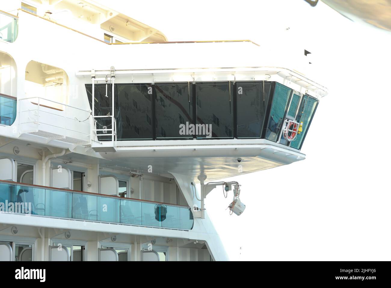 Bow and Bridge of a Massive Luxury Cruise Ship,Bridge Deck of Cruise Ship overlooking Downtown Office Buildings Stock Photo