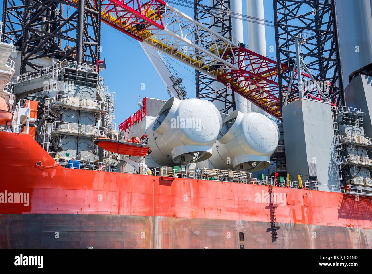 Detail of an offshore support ship for installation of wind turbines on a sunny day Stock Photo