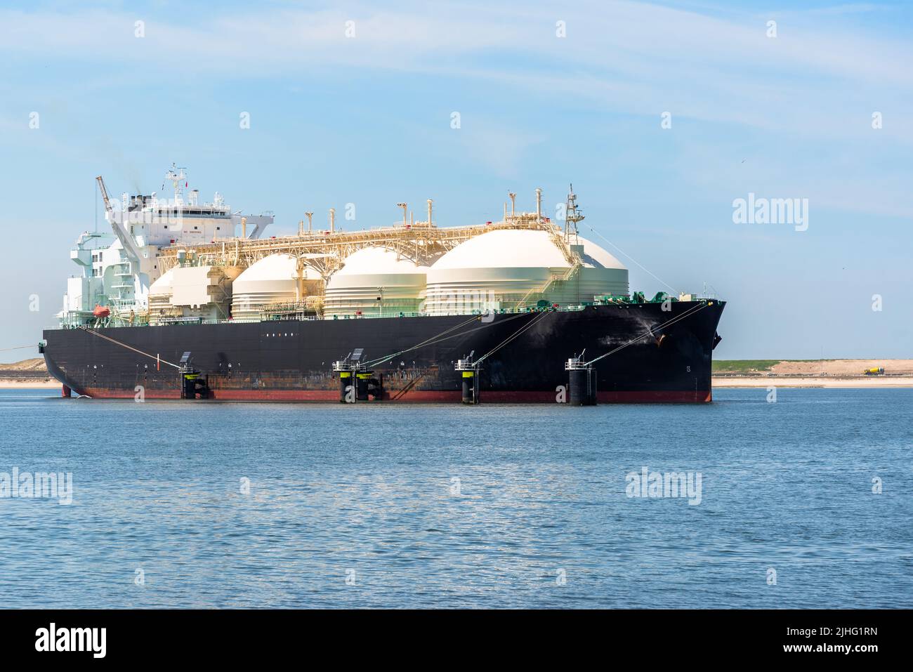 Large LNG tanker in a harbour on a sunny summer day Stock Photo