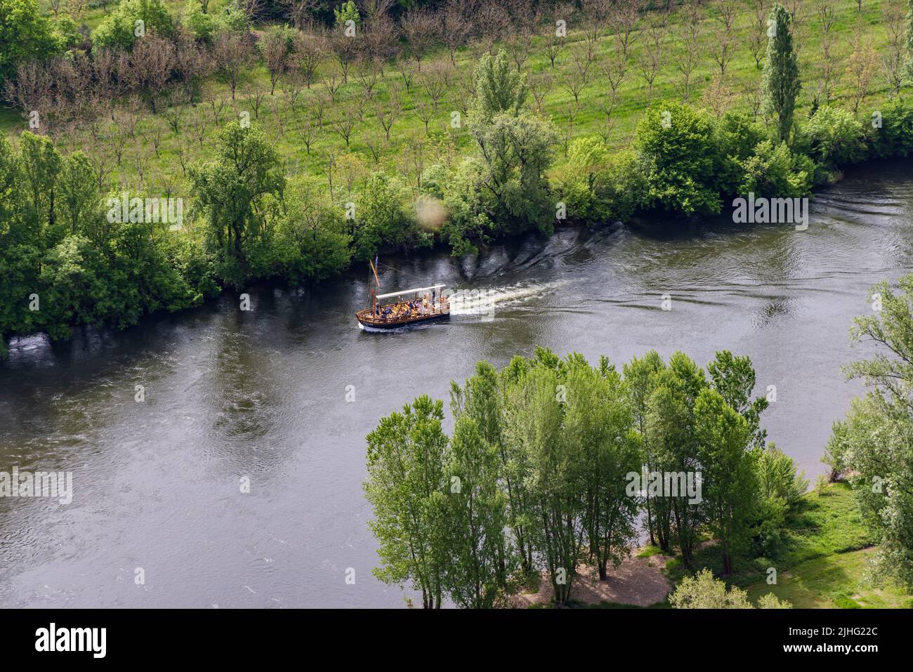 Vezac, Dorforgne, France - May 2, 2022: Awerial view on The Gabares traditional flat-bottomed boats along the river Dordogne in France Stock Photo
