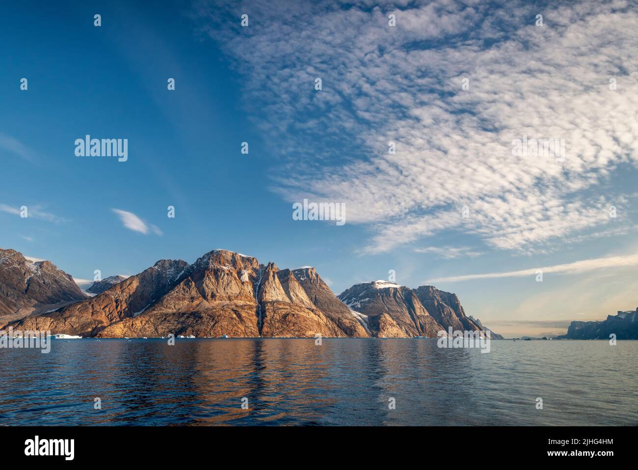 The mountain of Storhamrene in Ofjord, part of Scoresby Sound in east Greenland Stock Photo