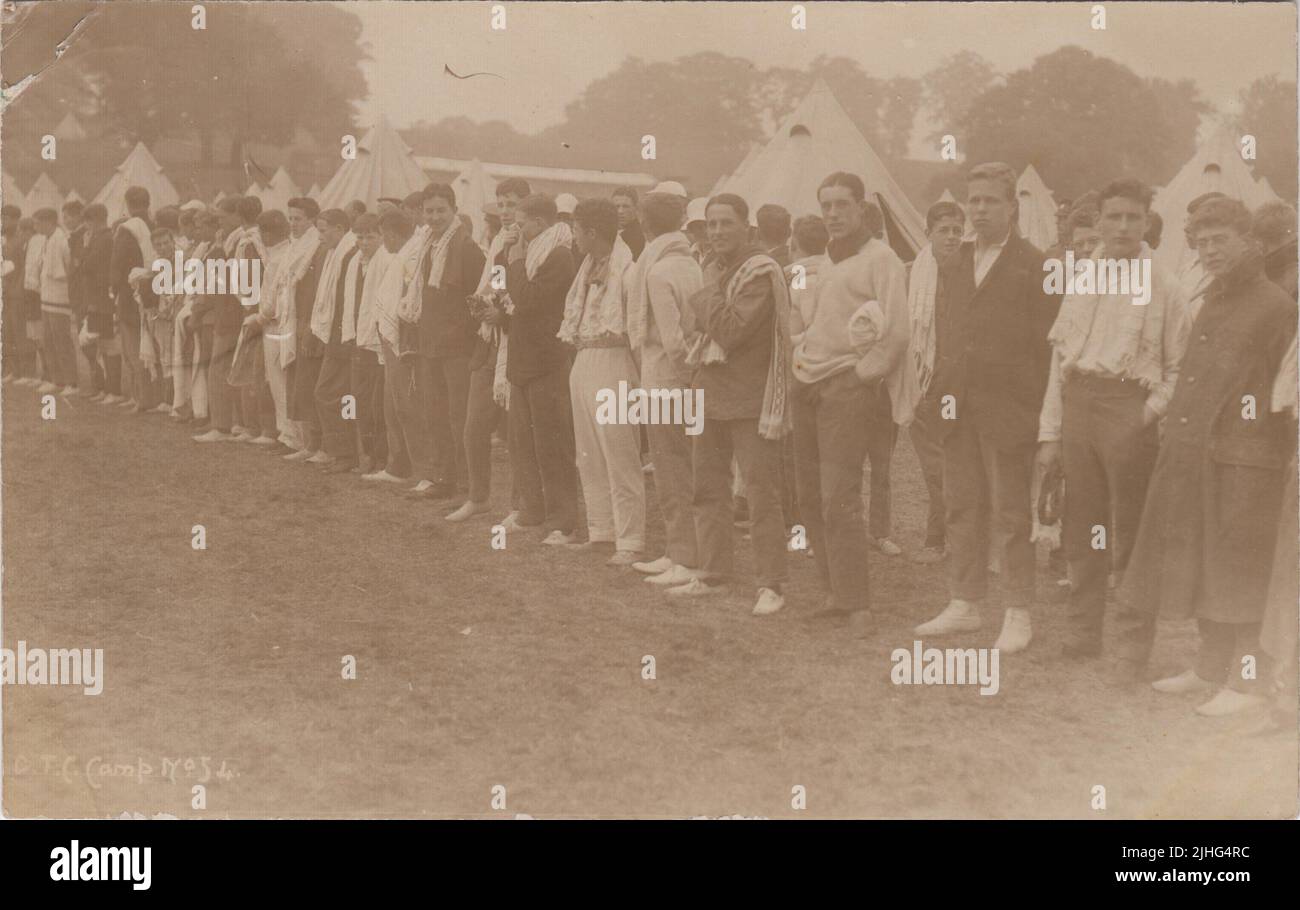 Officer Training Corps (OTC) camp, Hagley Park, Rugeley, Staffordshire, August 1914. Row of young men in civilian clothes with bell tents in the background. The photograph was taken during the first month of the First World War and shows early volunteers for Kitchener's Army Stock Photo